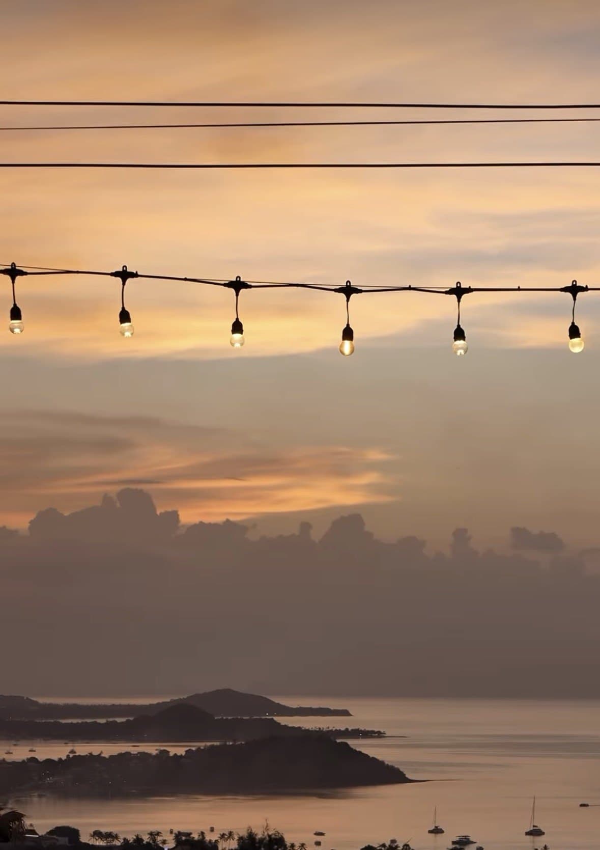 Sunset, coastline and terrace lights